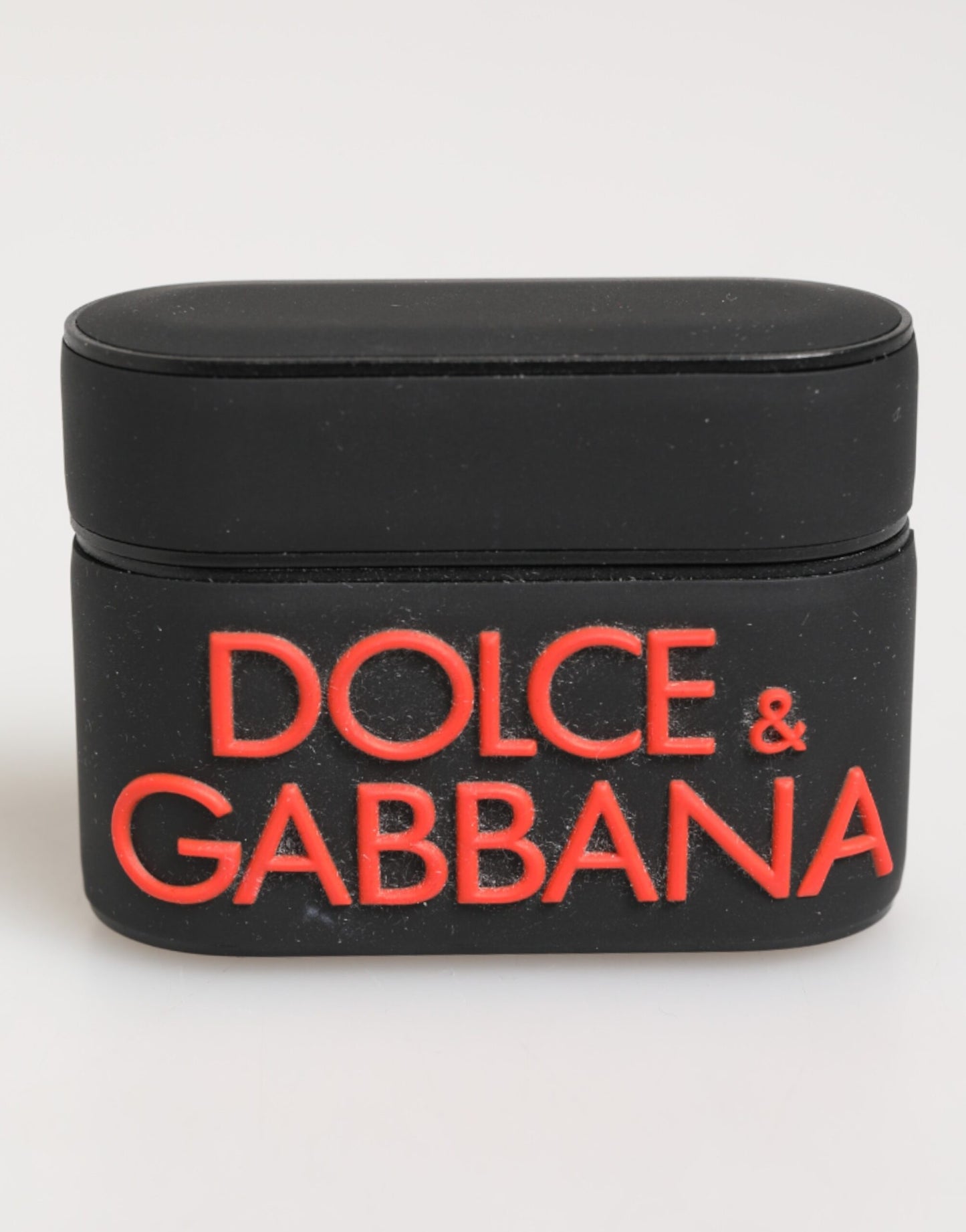 Funda para Airpods Dolce & Gabbana negra, naranja, de goma con logo grabado en relieve