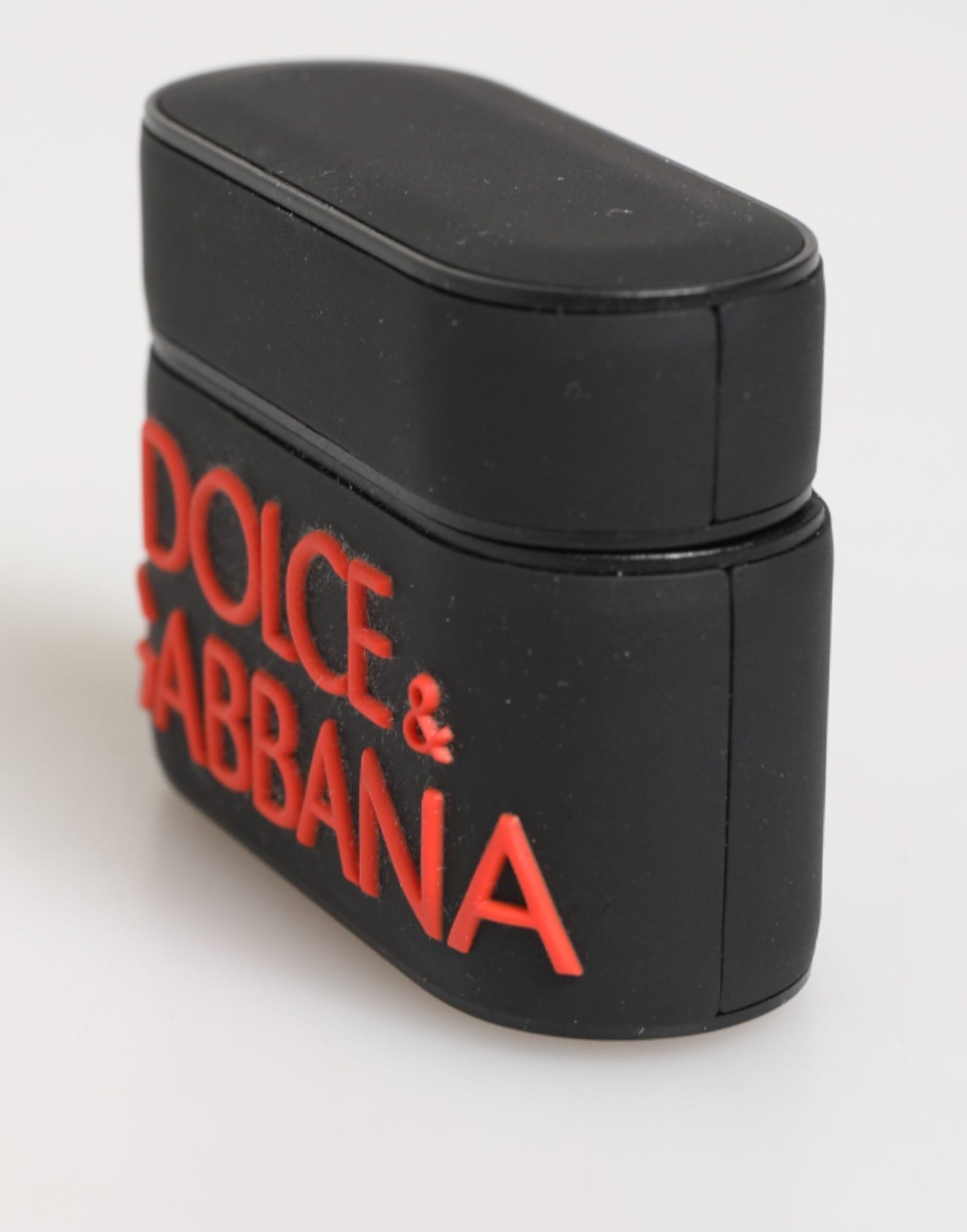 Funda para Airpods Dolce & Gabbana negra, naranja, de goma con logo grabado en relieve