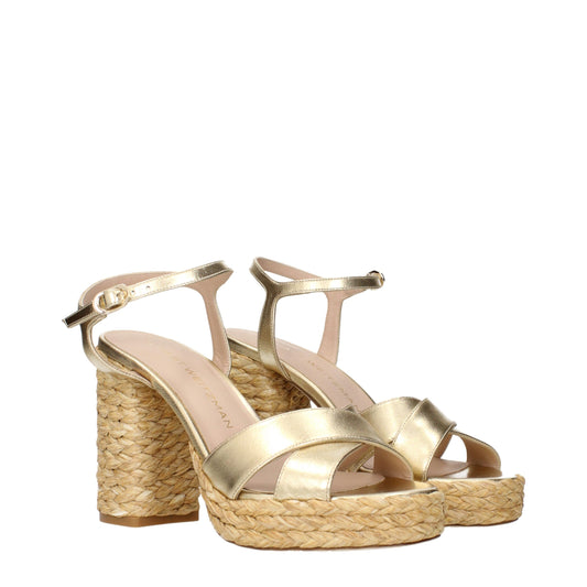 Sandalias de plataforma Stuart Weitzman de cuero dorado