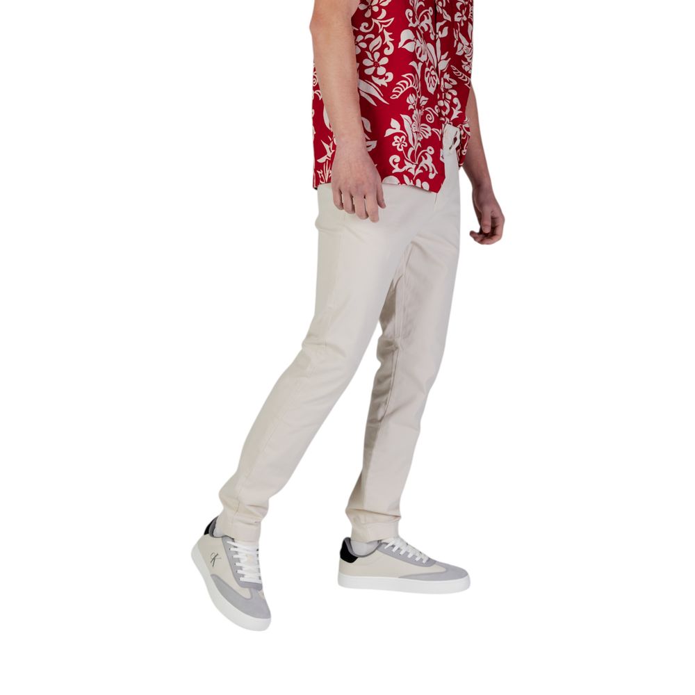 Pantalones ajustados Tommy Hilfiger de mezclilla beige de algodón