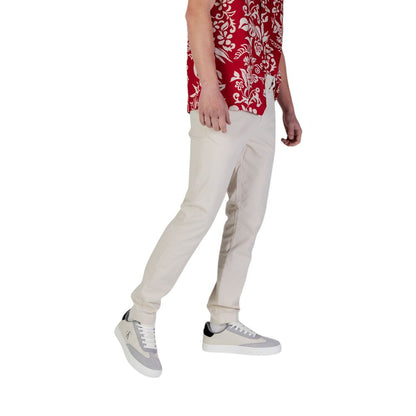 Pantalones ajustados Tommy Hilfiger de mezclilla beige de algodón
