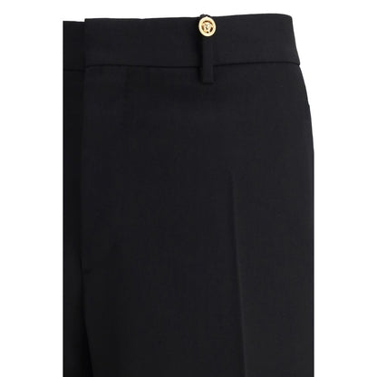 Pantalon habillé Versace en laine noire Oves Aries